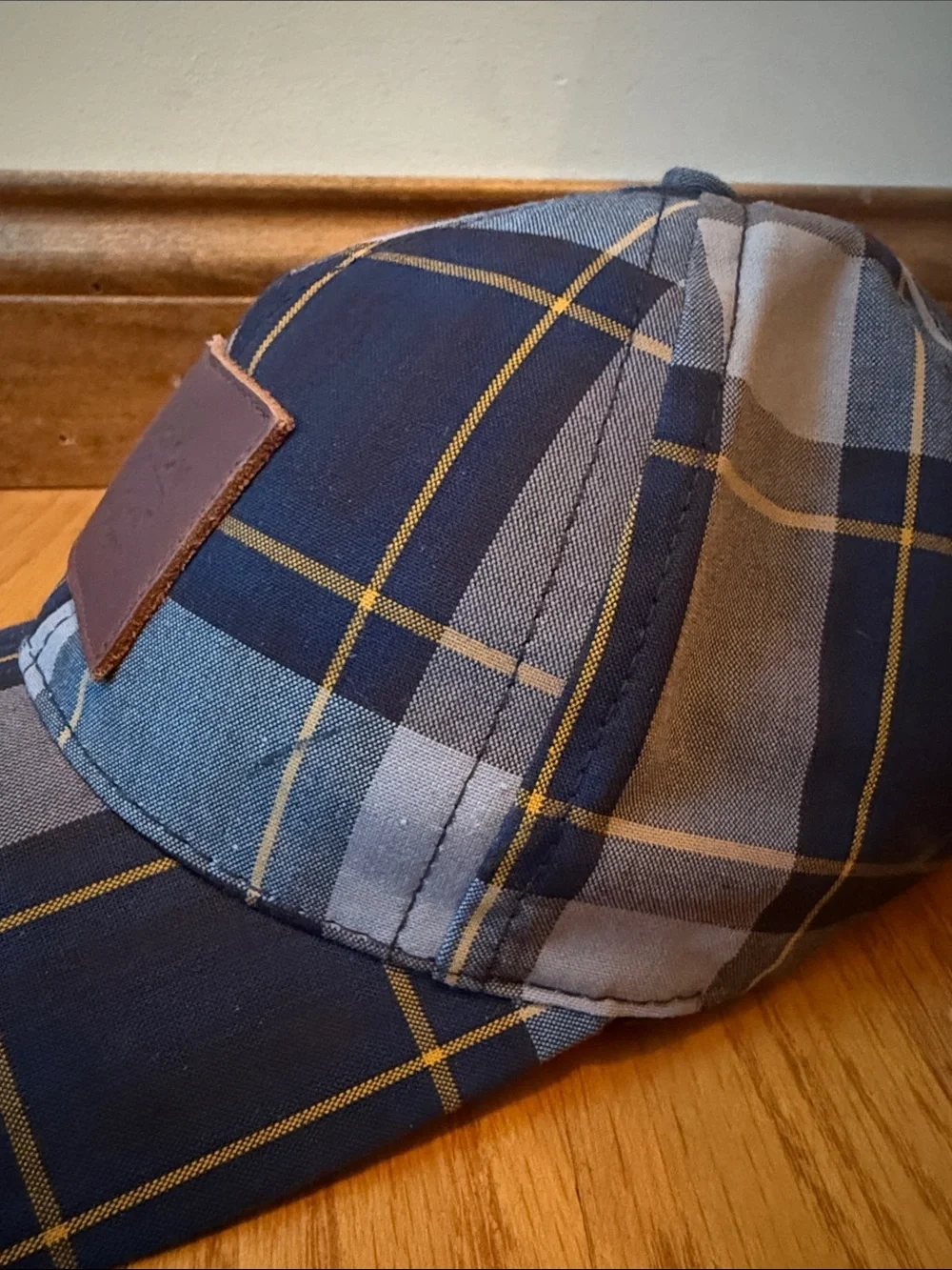 Love your melon plaid hat with leather logo